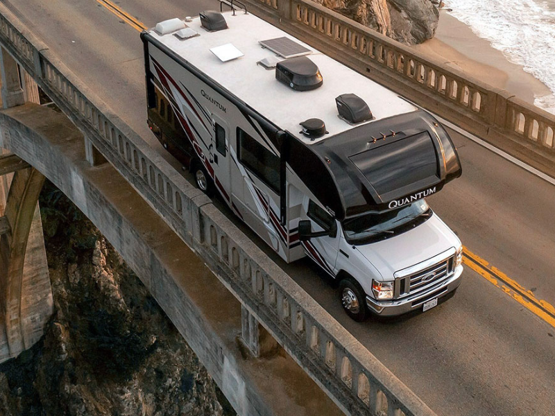 Which Starlink KIT is Best For In-Motion Use – an RV driving with a Starlink high performance dish mounted on the roof, showing mobile satellite internet in action.