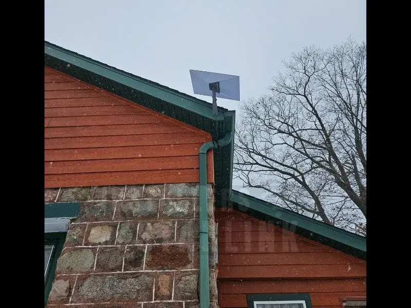 A completed Starlink install using a wall mount to the fascia board on a 2 story home done by our installers.