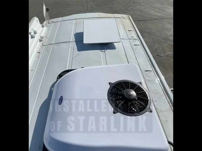Top view of a completed Starlink installation on a medical service sprinter van done by our installers.