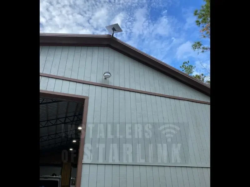 A completed Starlink wall mount to the fascia board of commercial RV repair business done by our installers.